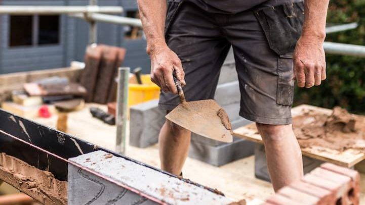 Bricklayer Building A Wall