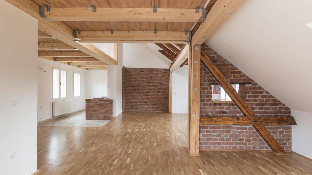 Room With Exposed Oak Beams And Wooden Floor